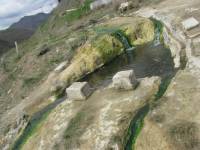 Топлите минерални води се зареждат с лечебните си съставки в Ерма река край Златоград, а изтичат в Гърция