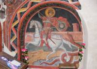 Стара фреска в Кремиковския манастир, изографисана в нишата на южната му стена, изобразяваща свети Георги на кон, убиващ змея