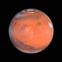 Тази снимка на телескопа „Хъбъл“ от 1999 г. показва Марс, отдалечен на 87 милиона километра от Земята Снимка: НАСА